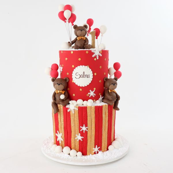 עוגת דובונים ובלונים באדום וזהב לכריסמס עם שלג מעוצבת בבצק סוכר לחגיגות יום הולדת